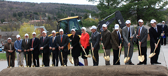 Student Leadership Center ground breaking ceremony - dignitaries holding golden shovels standing near a pile of dirt