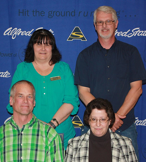 Pictured, sitting, from left to right, are Andrew Bayus and Patricia Lewis-Brownell. Back row, from left to right, are Deborah Neu and Roger Elias.