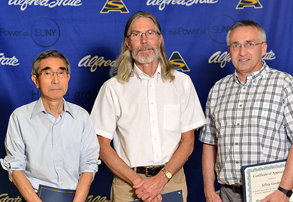 left to right, are Takao Takeuchi, Mark Amman, and Jeffrey Goodrich