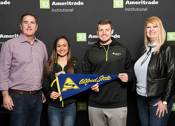 Pictured at TD Ameritrade’s 2018 National LINC Conference in Orlando, FL, from left to right, are Tom Nally, president, TD Ameritrade Institutional; Alfred State financial planning majors Madison Webster and Adam Wilkins; and Kate Healy, managing director, Generation Next, TD Ameritrade Institutional.