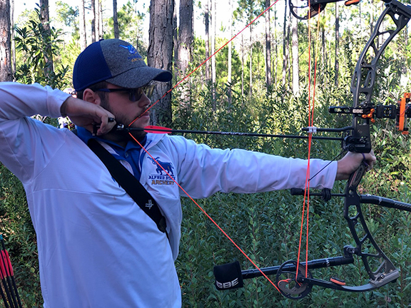 Team member Jacob Houseknecht, culinary arts, Candor, draws his bow during the USA Archery Collegiate 3-D National Championships in Foley, AL.