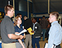 student speaking with employers at fair