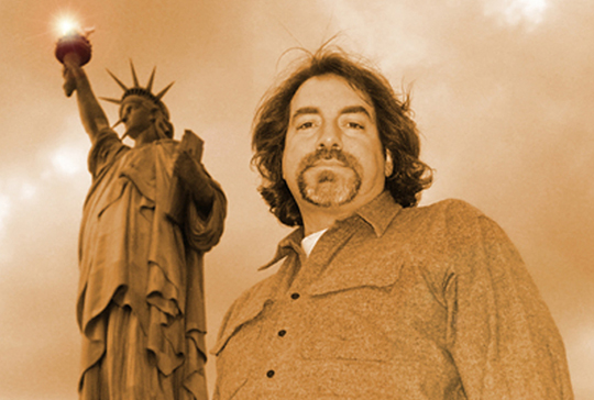 Dennis Heaphy with Statue of Liberty behind him