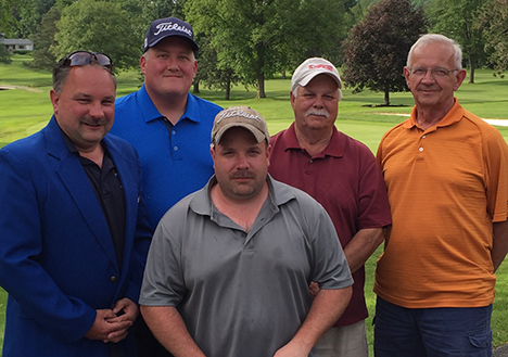 winners of the Alfred State Inaugural Golf Tournament, along with Charles Wiser, who donated the blue jacket that was given to the captain of the team. In the front row is Alfred State University Police Campus Public Safety Officer Craig Heller. In the back row, from left to right, are Alfred State University Police Lt. Matt Heller, Jeff Wilcox, Walt Heller, and Wiser.