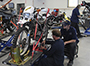 students working on motorcycles in the lab