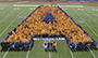 Students, faculty, and staff create a human Alfred State logo