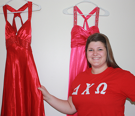 Olivia Ciesla with 2 red prom dresses