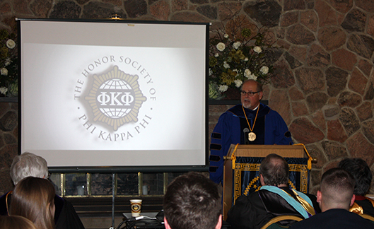 Alfred State President Dr. Skip Sullivan speaks during a Phi Kappa Phi honor society induction ceremony 