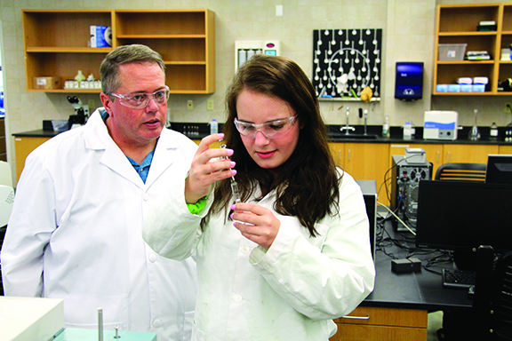Wayne with a student in a lab