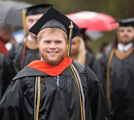 student wearing a cap and gown